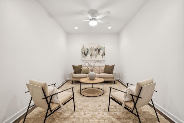 sitting room with ceiling fan