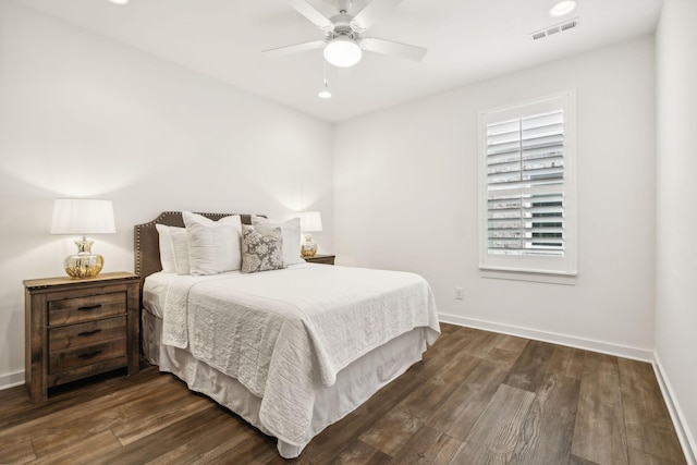 bedroom with dark wood-type flooring and ceiling fan