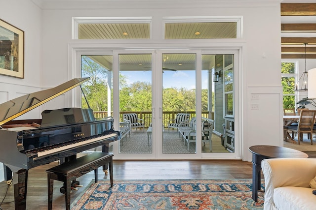 entryway with hardwood / wood-style floors and an inviting chandelier