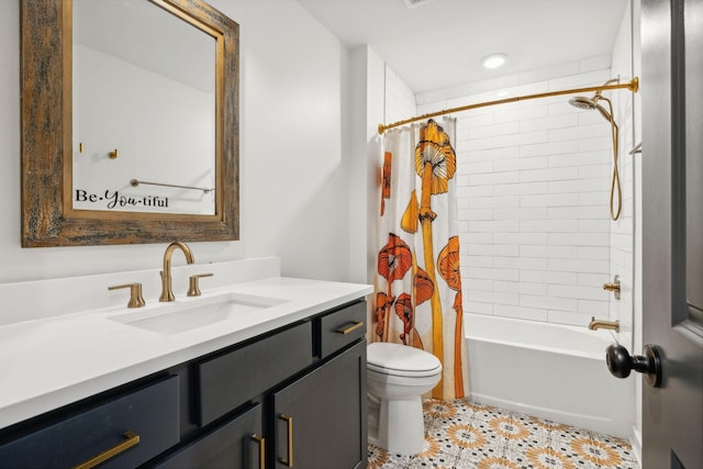 full bathroom featuring vanity, tile patterned flooring, toilet, and shower / bath combo with shower curtain