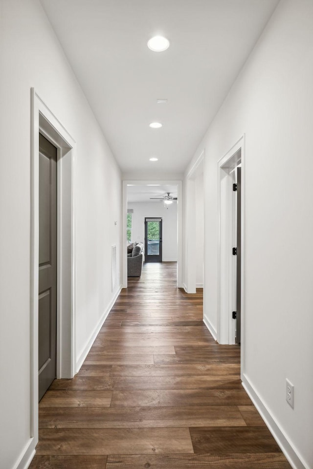 hallway featuring dark hardwood / wood-style flooring