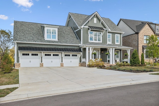 view of front of property with a porch and a garage