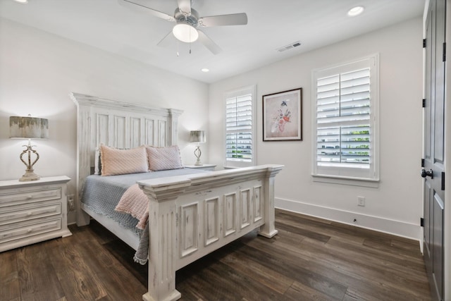 bedroom featuring dark hardwood / wood-style flooring and ceiling fan