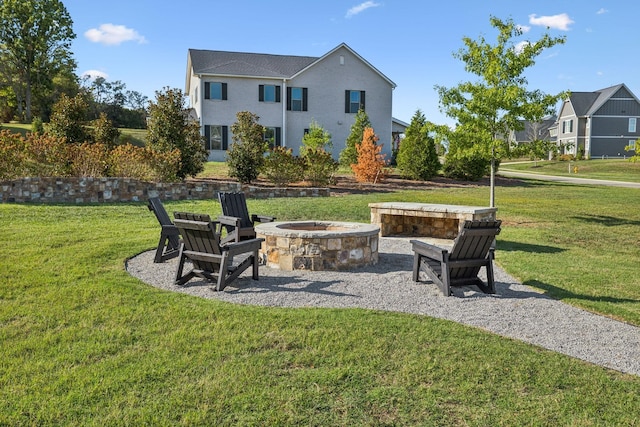 view of yard with an outdoor fire pit and a patio