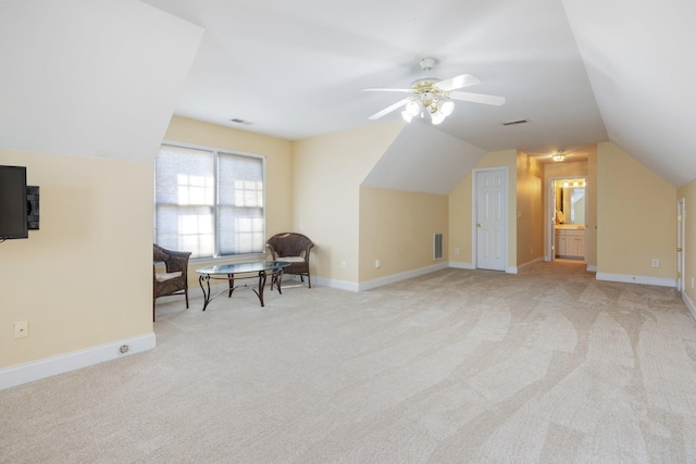 bonus room featuring ceiling fan, light colored carpet, and vaulted ceiling