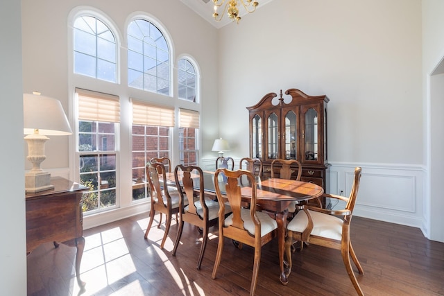 dining room featuring dark hardwood / wood-style floors and a notable chandelier