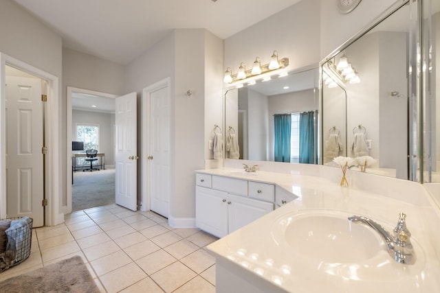 bathroom with tile patterned flooring and vanity