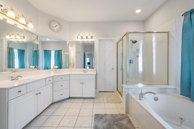 bathroom with vanity, independent shower and bath, and tile patterned flooring