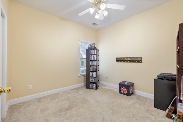 miscellaneous room featuring light colored carpet and ceiling fan