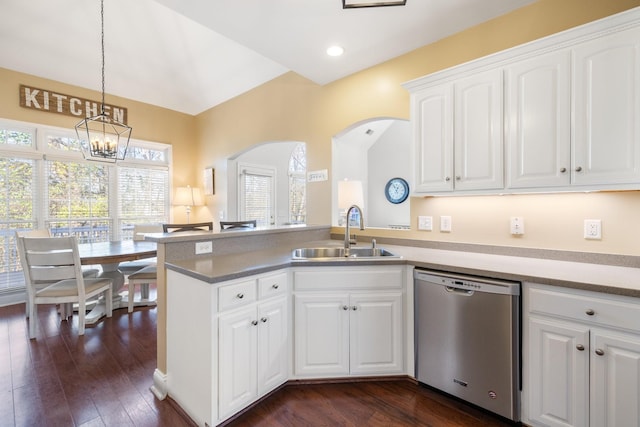 kitchen with pendant lighting, white cabinetry, sink, stainless steel dishwasher, and dark wood-type flooring