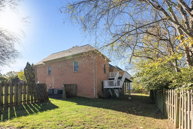 view of side of property with a yard