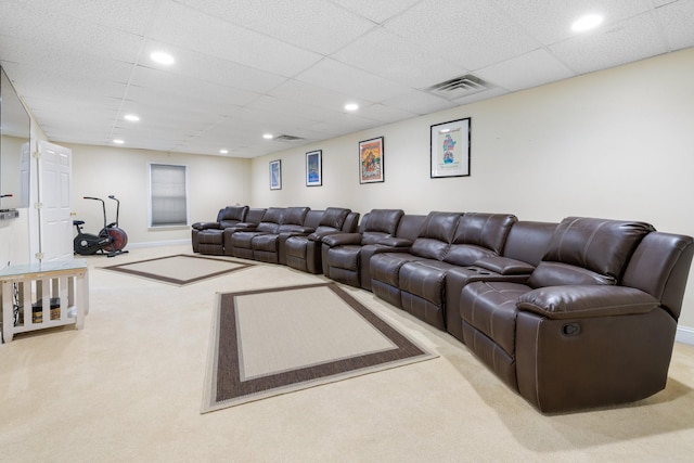 living room with light colored carpet and a drop ceiling