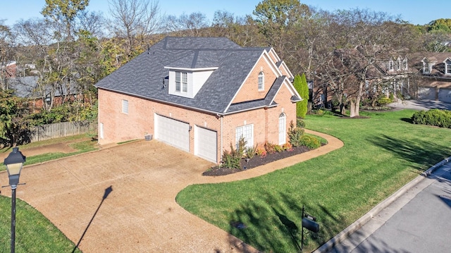 view of side of property with a garage and a lawn