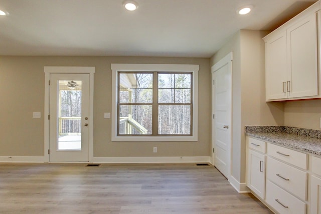 doorway featuring light hardwood / wood-style floors