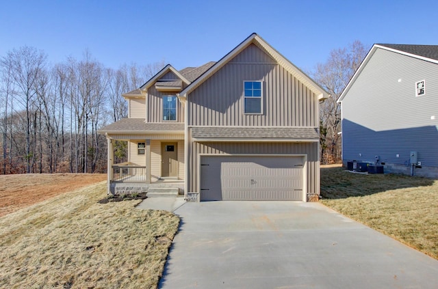 view of front facade featuring a garage, central AC unit, covered porch, and a front lawn