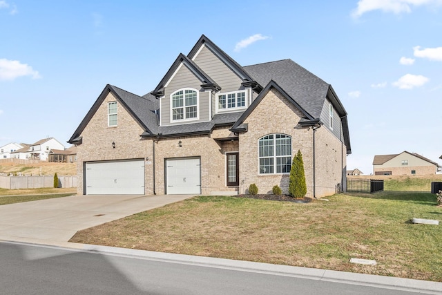 view of front of home with a garage and a front lawn