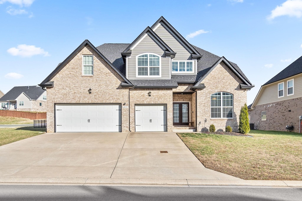 view of front facade with a garage and a front yard