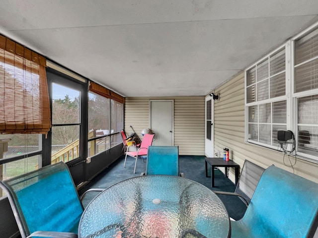 unfurnished sunroom with a jacuzzi