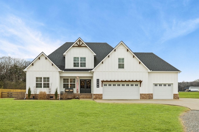 modern farmhouse style home with a front lawn