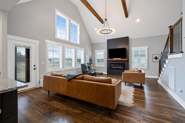 living room with an inviting chandelier, high vaulted ceiling, a fireplace, dark hardwood / wood-style flooring, and beamed ceiling