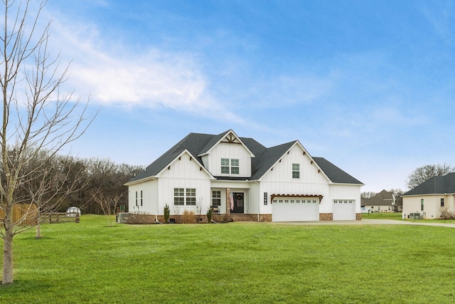 modern farmhouse featuring a garage and a front yard