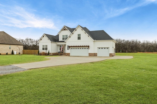 modern inspired farmhouse with a garage and a front yard