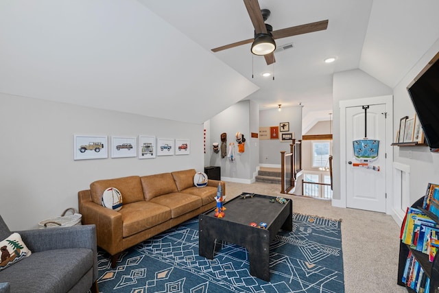 carpeted living room featuring ceiling fan and lofted ceiling