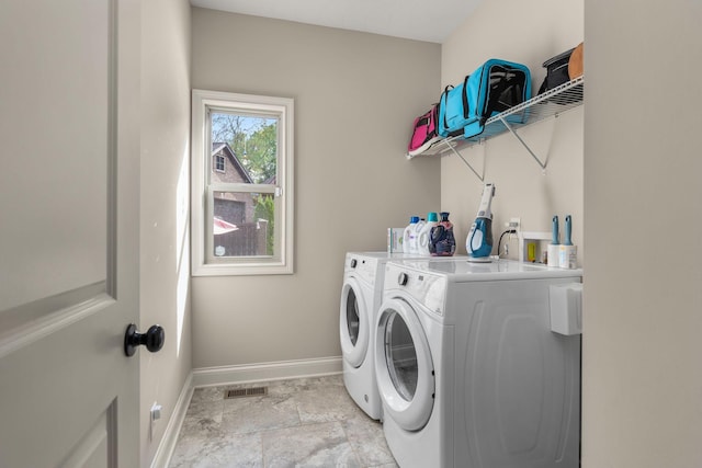 washroom with separate washer and dryer