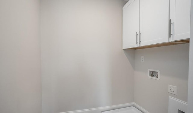 laundry room with cabinets and washer hookup