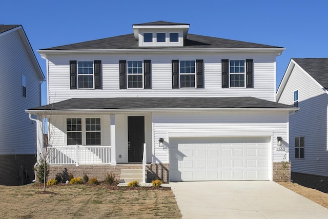 view of front facade with a garage and covered porch