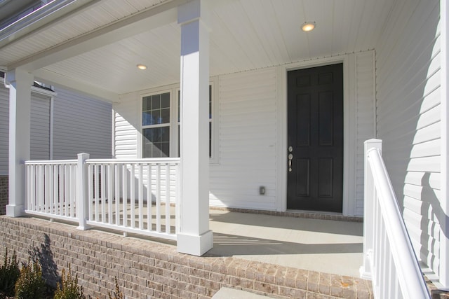 property entrance with covered porch