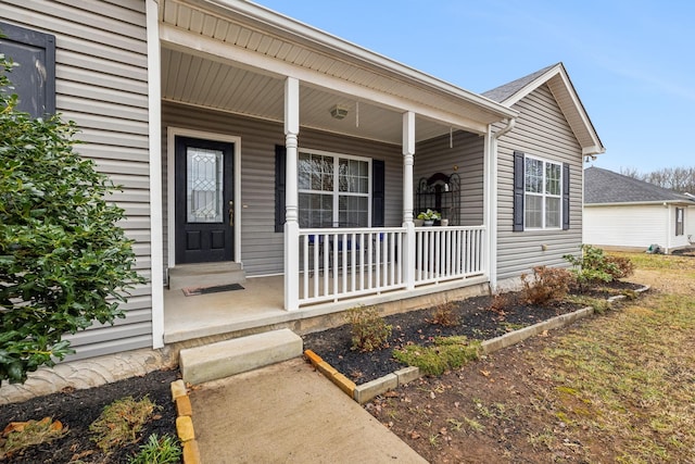 doorway to property with a porch