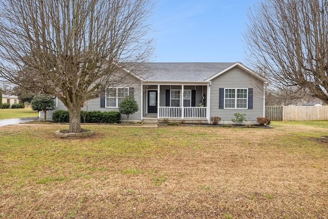 ranch-style home featuring a porch and a front yard