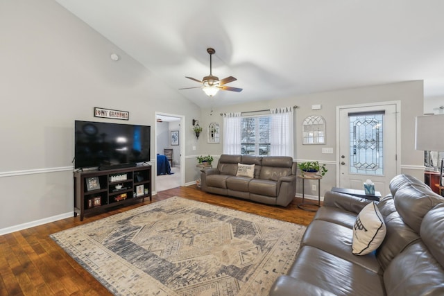 living room featuring hardwood / wood-style flooring, lofted ceiling, and ceiling fan