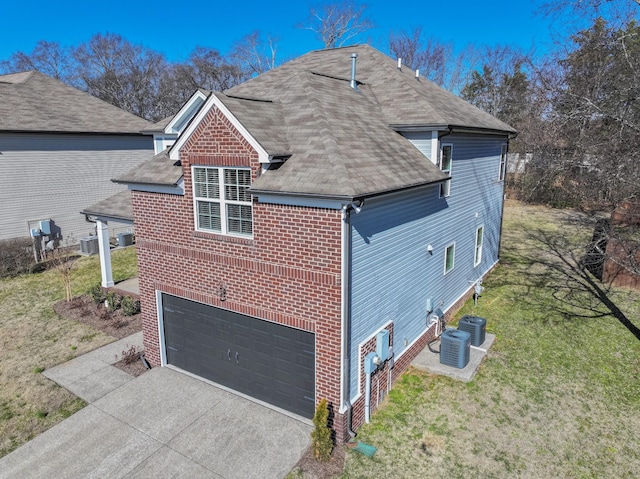 view of property exterior with a garage, a yard, and central air condition unit