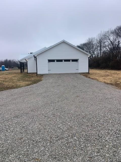 view of side of property with a garage