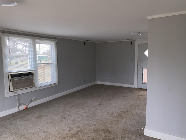 carpeted spare room featuring cooling unit