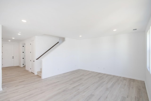 spare room featuring light hardwood / wood-style floors