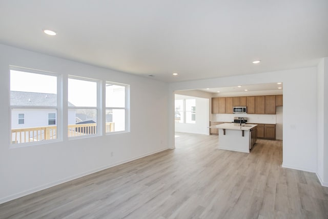 unfurnished living room featuring light hardwood / wood-style flooring