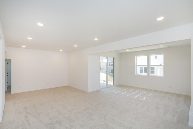 empty room with light colored carpet