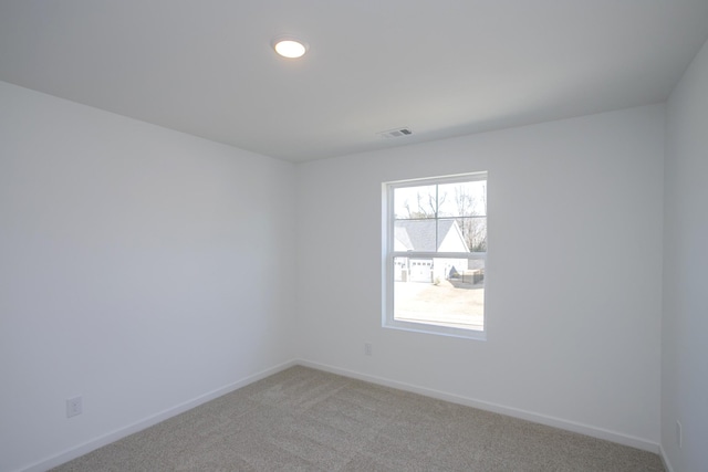 spare room featuring carpet flooring