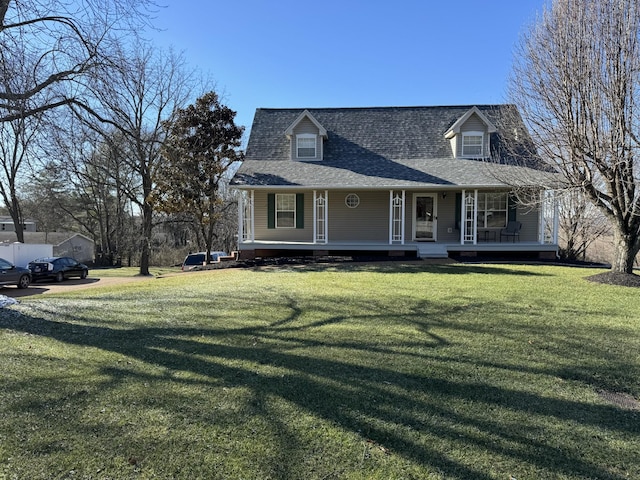 cape cod home with a porch and a front lawn