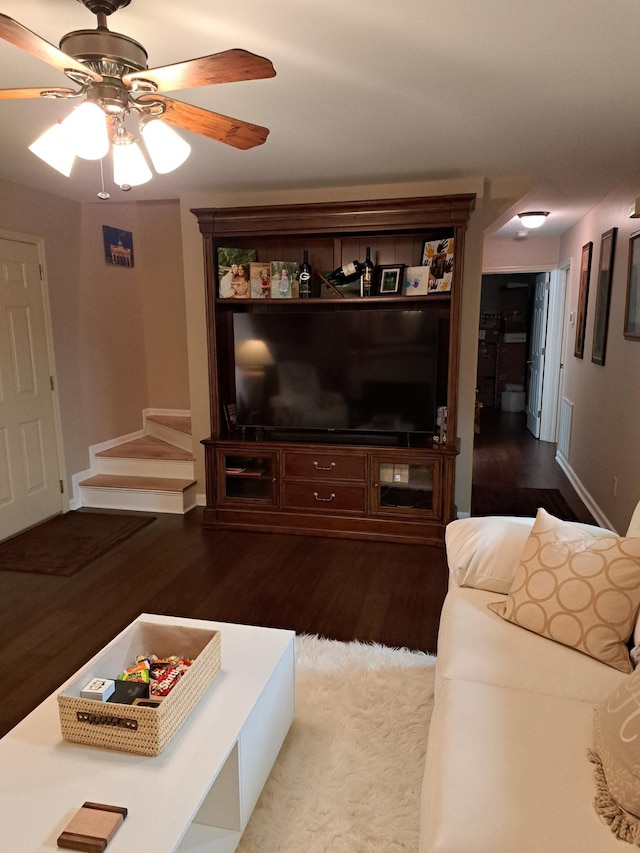 living room with hardwood / wood-style flooring and ceiling fan