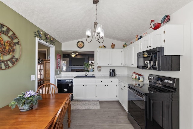 kitchen featuring sink, black appliances, light hardwood / wood-style floors, and white cabinets