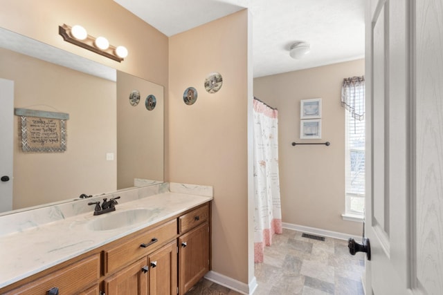 bathroom featuring vanity and a shower with curtain