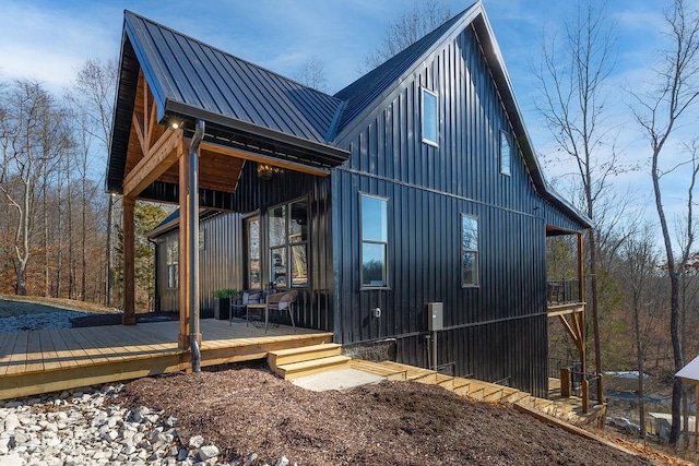 rear view of property featuring a deck