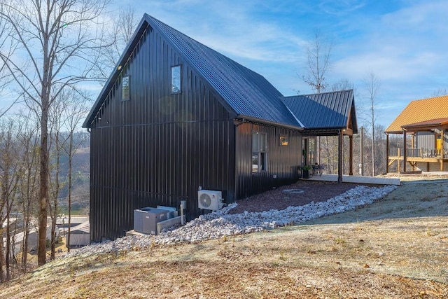 view of side of property featuring ac unit