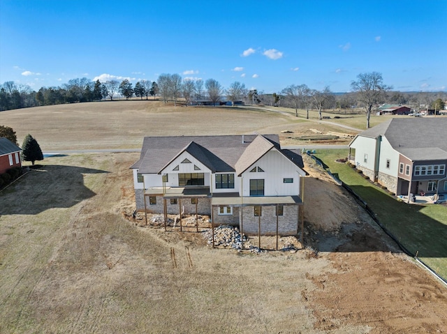 birds eye view of property featuring a rural view