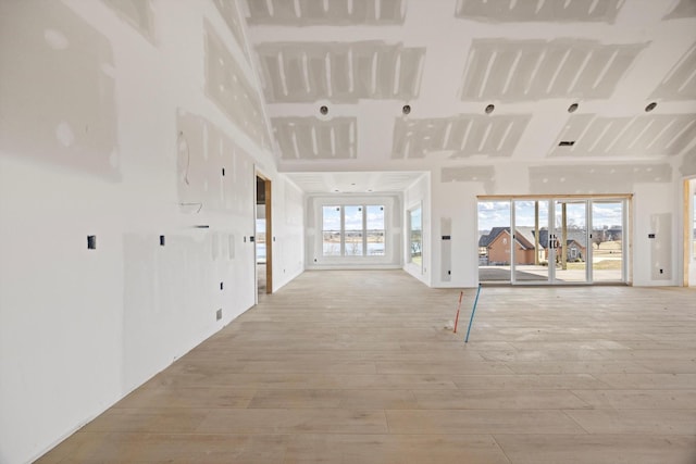 unfurnished living room with light hardwood / wood-style floors