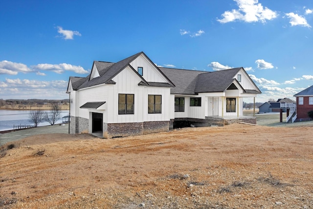 view of front of house featuring a water view